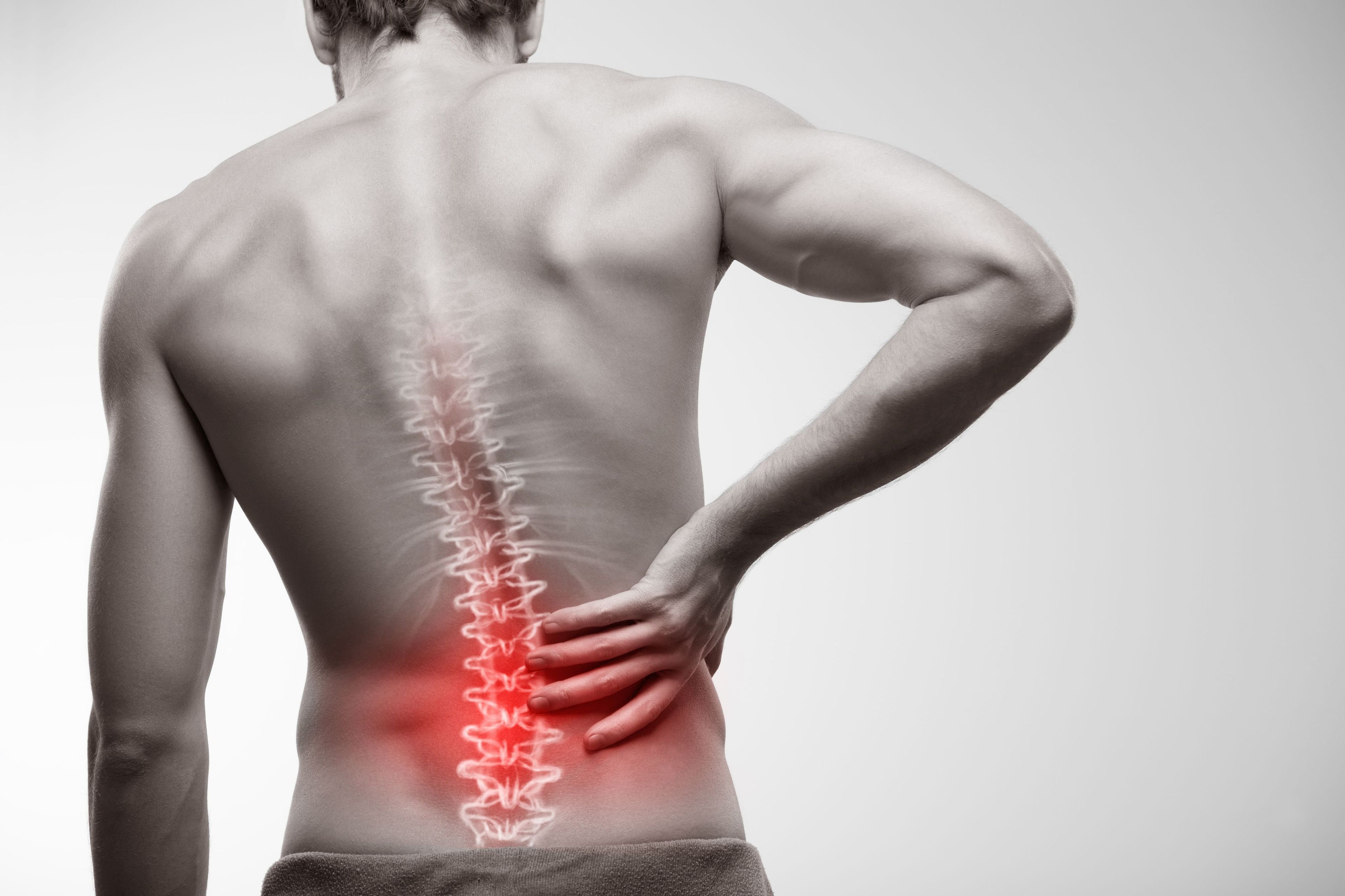 Person experiencing lower back pain
