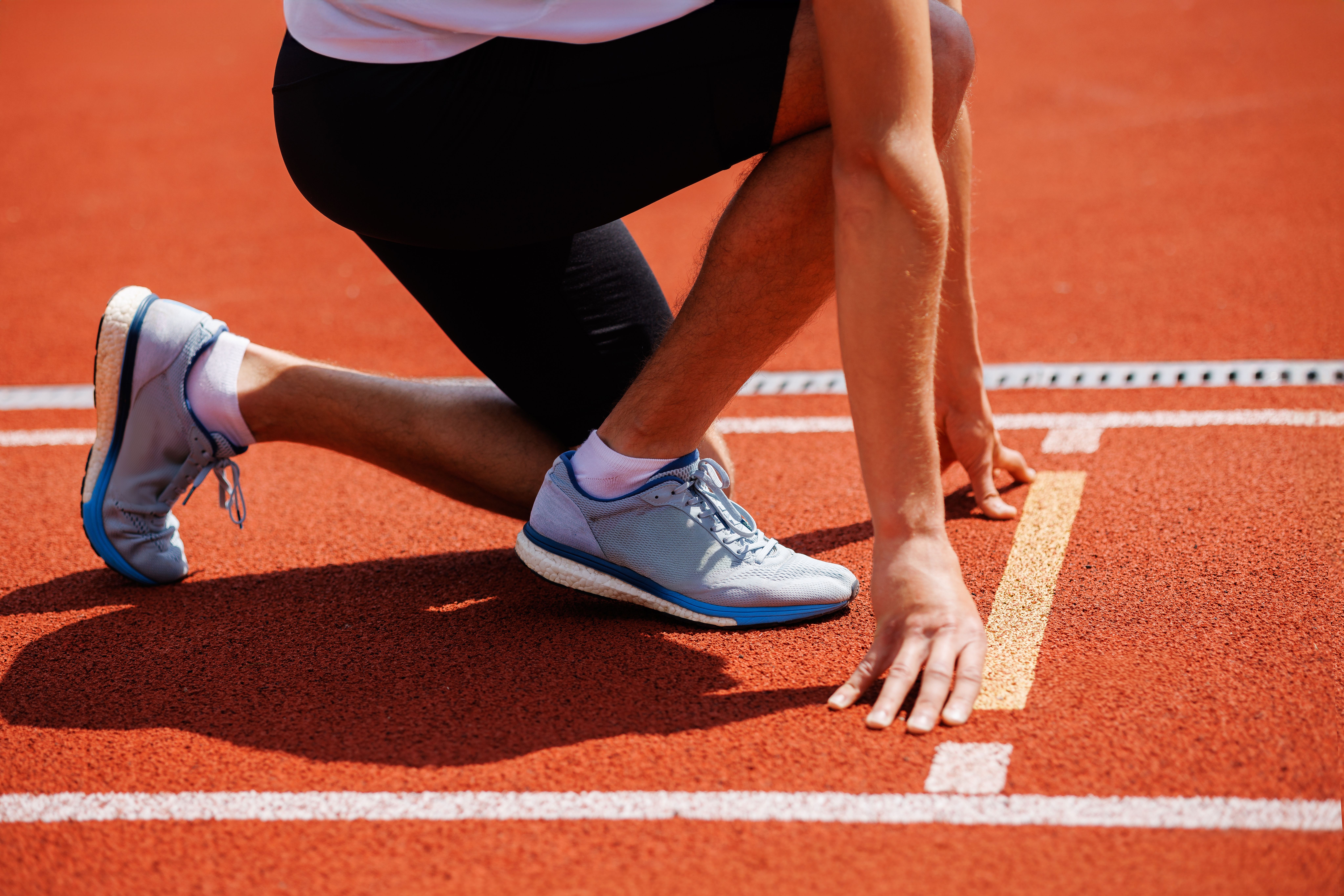 A picture of an athlete all set on the running track is used to portray how deuk spine institute emerged in 2004.